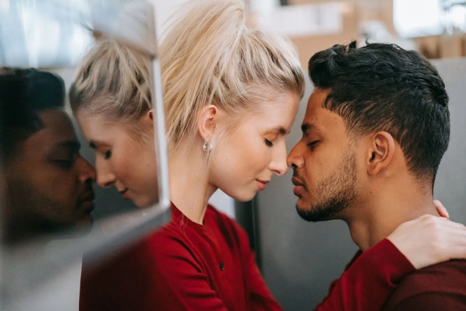 A couple sharing a quiet, tender moment together at home